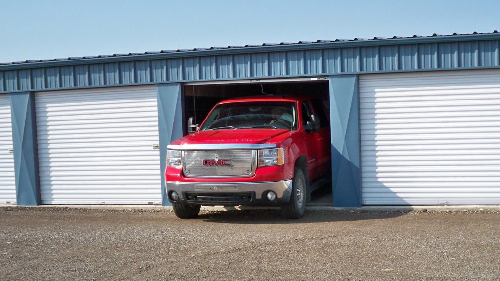 Photo of a quad cab dually pickup truck backing into self storage Airdrie